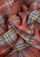 Recycled wool blanket in Stewart Royal Antique Tartan with blue, red, and green plaid, cozy and warm for home decor.