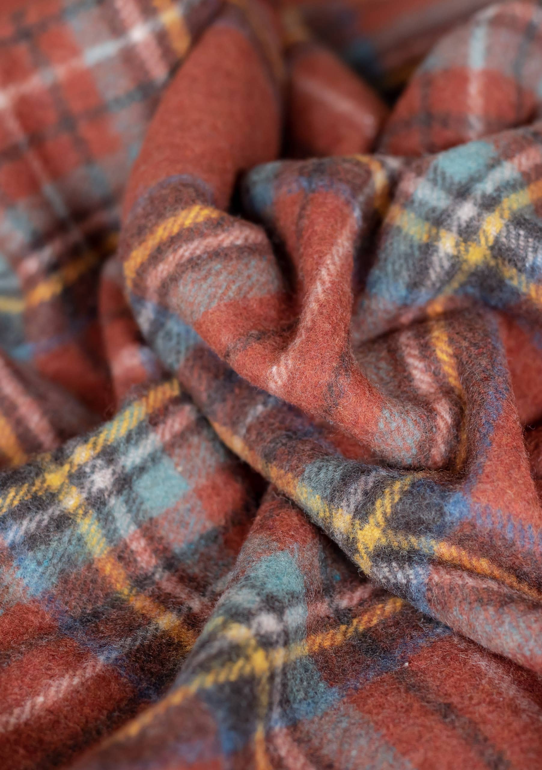 Recycled wool blanket in Stewart Royal Antique Tartan with blue, red, and green plaid, cozy and warm for home decor.