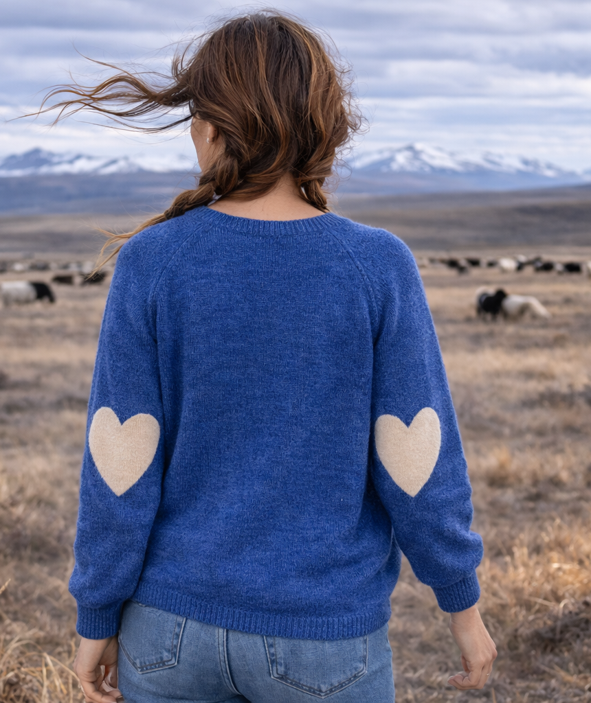 ISLEFIELD heart sleeve crewneck pullover shown in a stylish design with heart details on the sleeves.