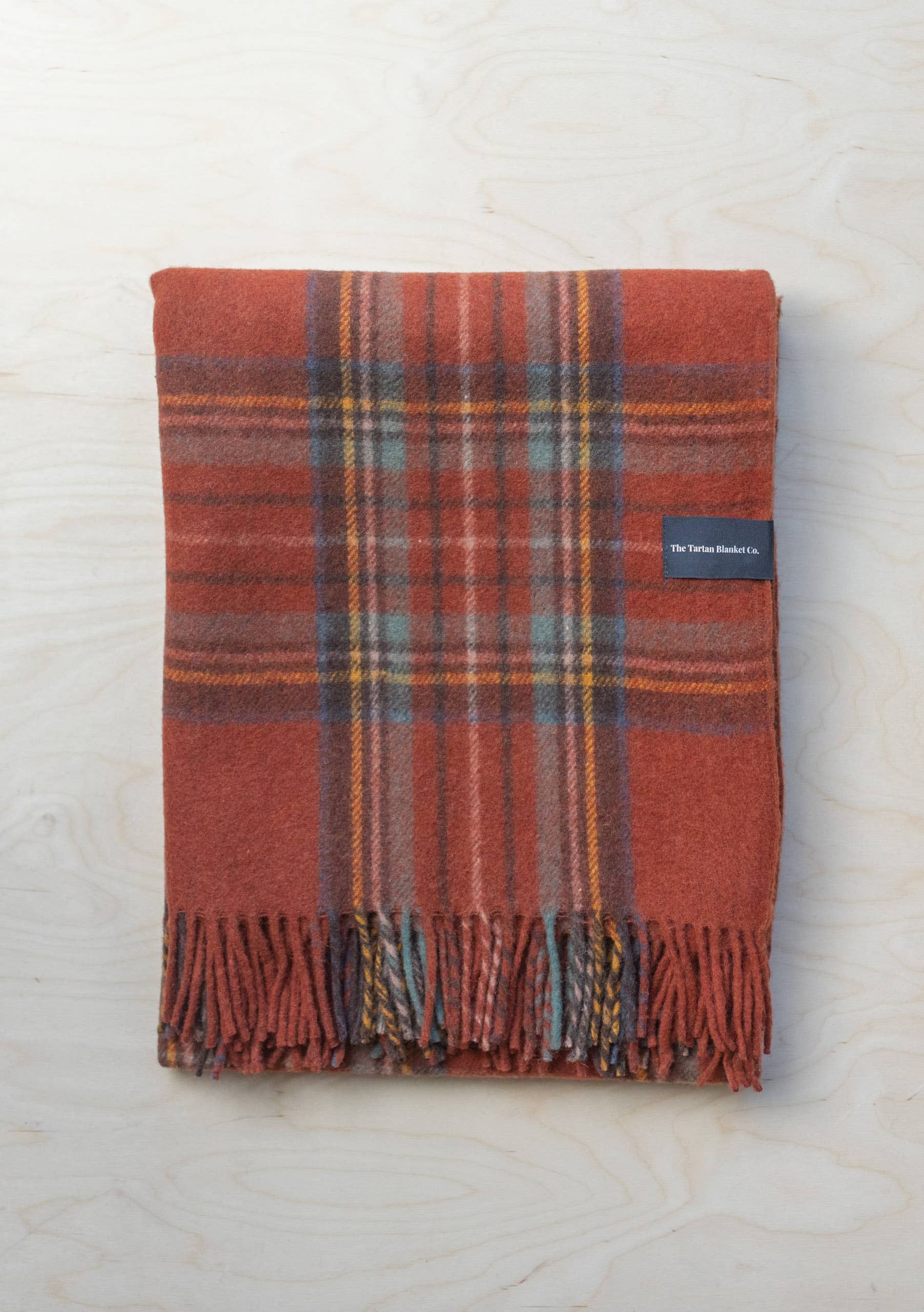 Recycled wool blanket in Stewart Royal Antique Tartan with classic plaid pattern, soft texture, and warm, cozy appearance.
