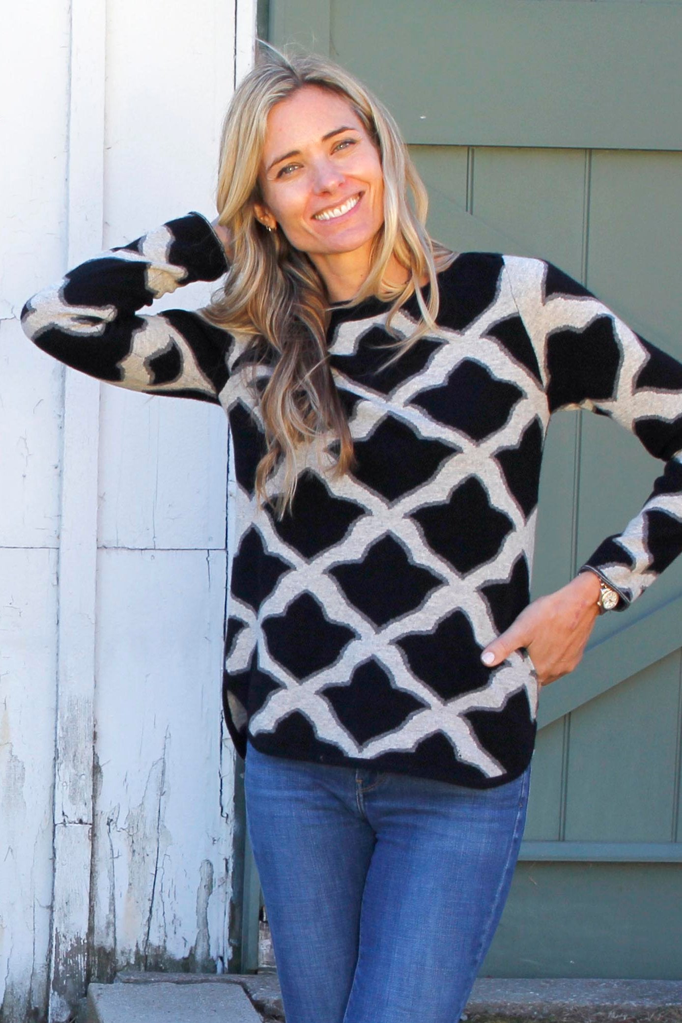 Black Fleur De Isle Cashmere Boatneck pullover by ISLEFIELD, close-up of soft cashmere fabric and classic boatneck design.
