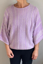 Lavender ISLEFIELD Go To Stripe pullover sweater displayed on a hanger, featuring a stylish striped design and cozy knit fabric.