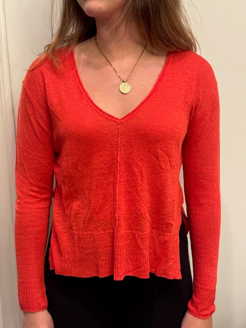 Coral linen V-neck pullover by ISLEFIELD, featuring lightweight, breathable fabric and a relaxed fit, perfect for casual wear.