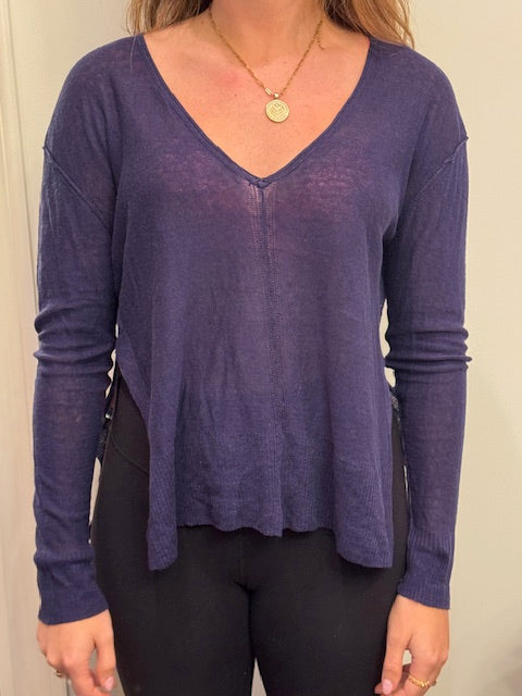 Navy linen V-neck pullover by ISLEFIELD, lightweight and breathable, displayed on a hanger against a white background.