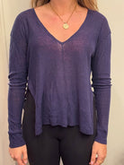 Navy linen V-neck pullover by ISLEFIELD, lightweight and breathable, displayed on a hanger against a white background.