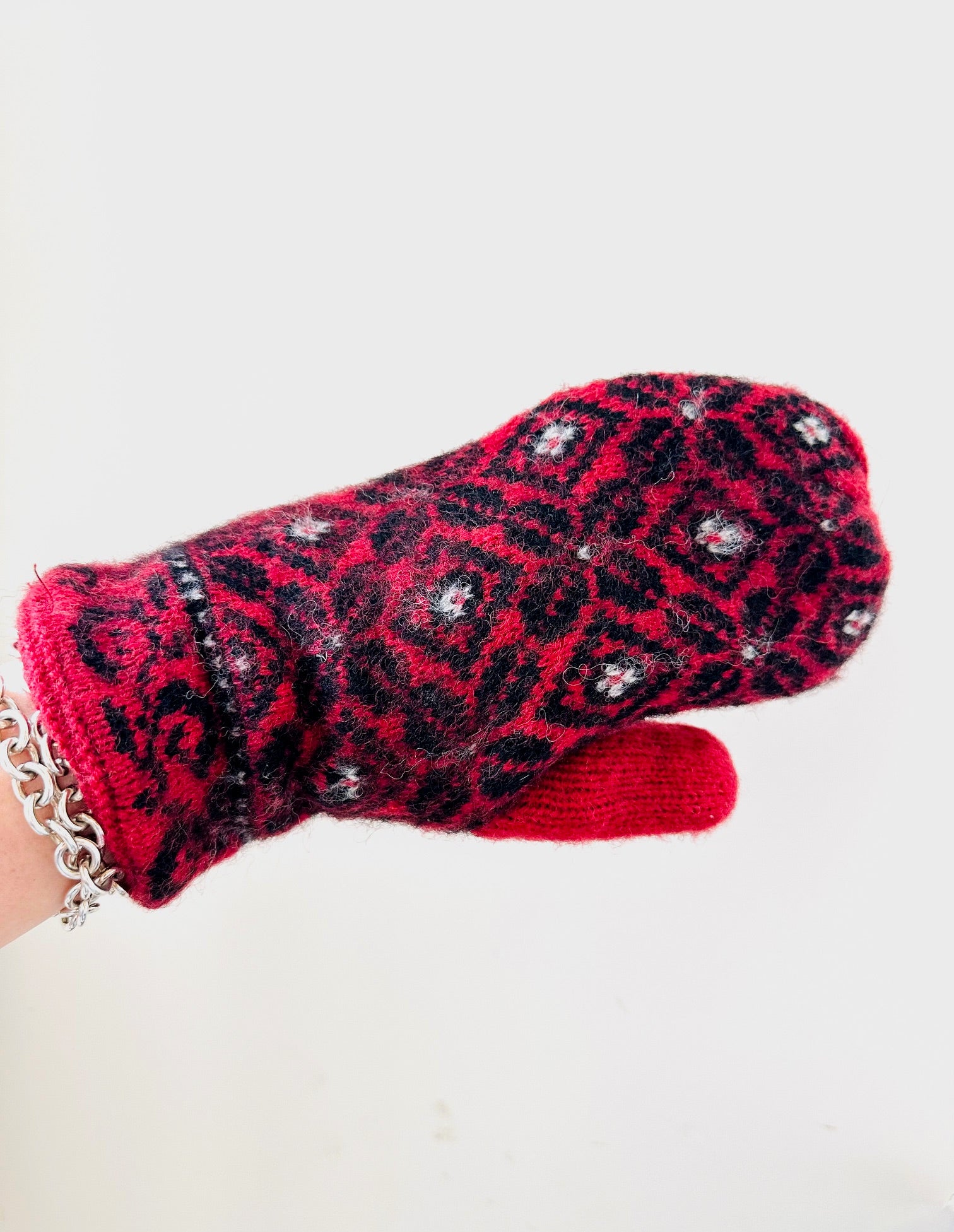 Red ISLEFIELD Nordic mitten, cozy accessory glove with a warm, knitted design perfect for winter outdoor wear.