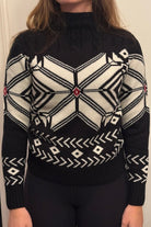 ISLEFIELD snowflake sweater featuring a festive winter pattern, soft knit fabric, and cozy fit for cold weather.