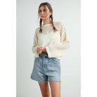 ISLEFIELD Star Open Waffle Sweater pullover with star pattern, cozy knit texture, and ribbed cuffs, displayed on a hanger.