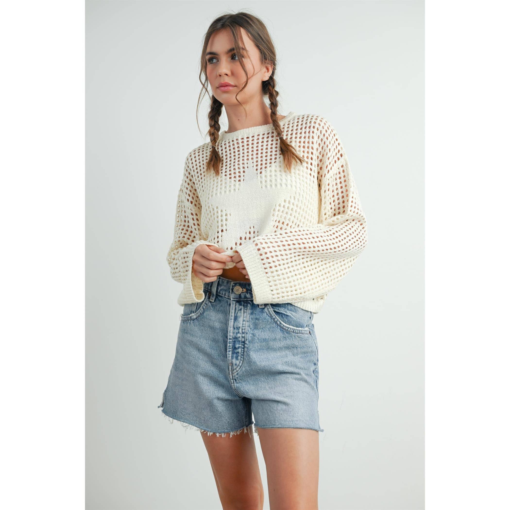 ISLEFIELD Star Open Waffle Sweater pullover with star pattern, cozy knit texture, and ribbed cuffs, displayed on a hanger.